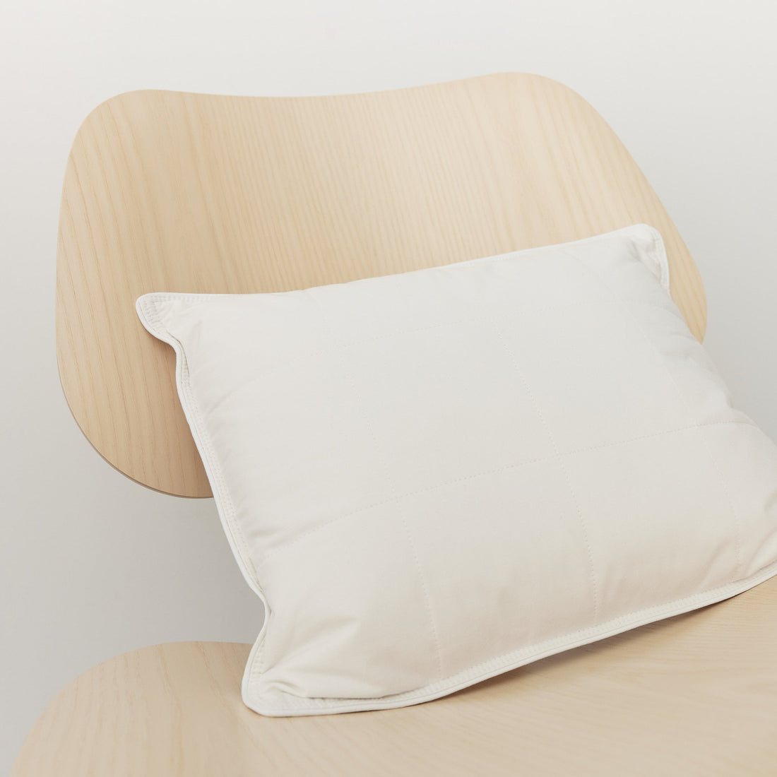 SmartSilk lumbar support pillow on oak chair